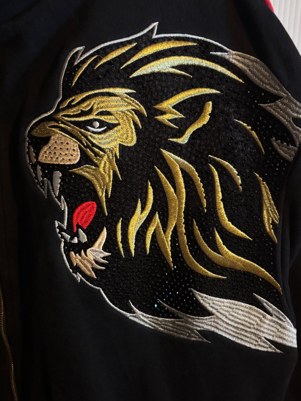 Makobi Black Lion-Embroidered Bomber Jacket with Red & Green Trim